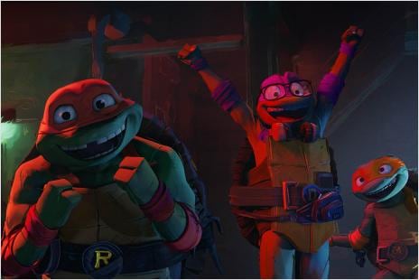 One ninja turtle with arms raised and his two turtle ninja buddies