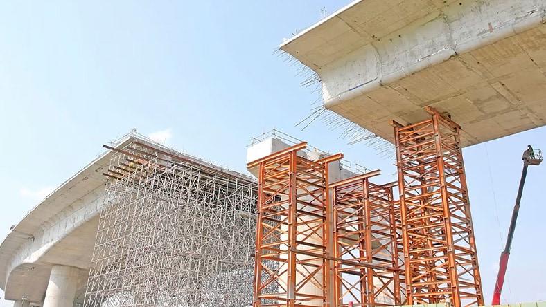 Illustration of owners and program managers discussing a project in an office setting, one reviewing a document while the other gestures toward a digital display, with charts and plans in the background.