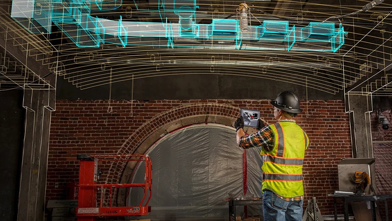 Woman standing in the foreground of cityscape model