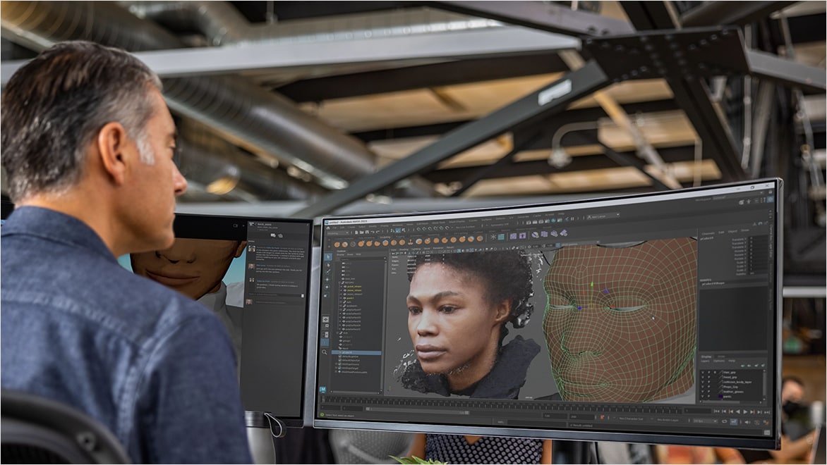 A man in a media and entertainment studio works at a computer showing Flow Production Tracking software.
