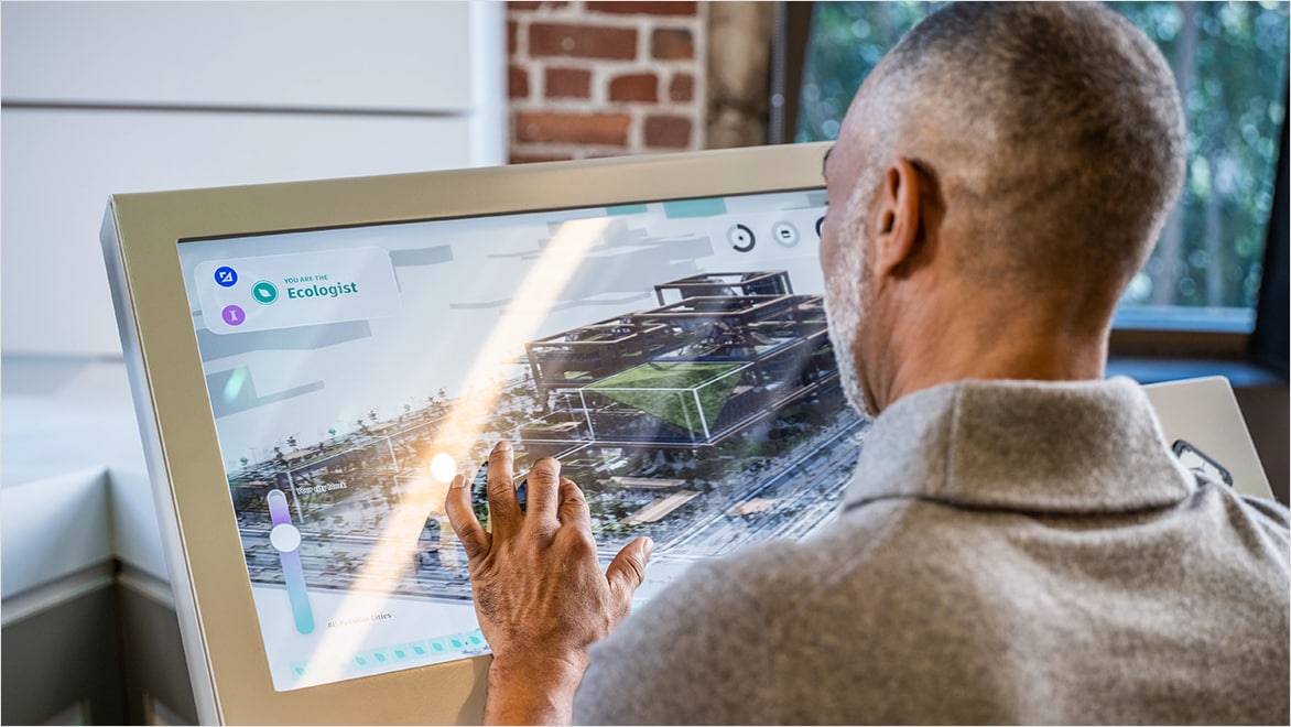 A builder working to create a 3D model using digital tools such as Autodesk design software