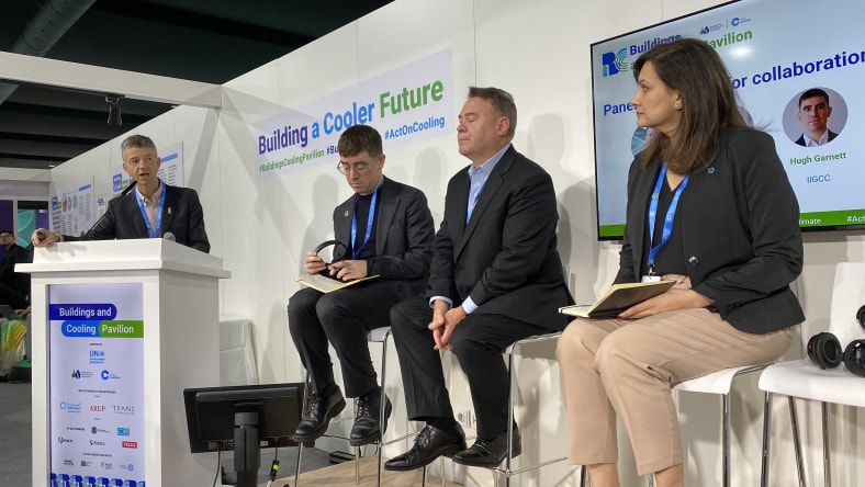 Four people talking in a panel