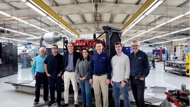 Members of the M2X team on the factory floor