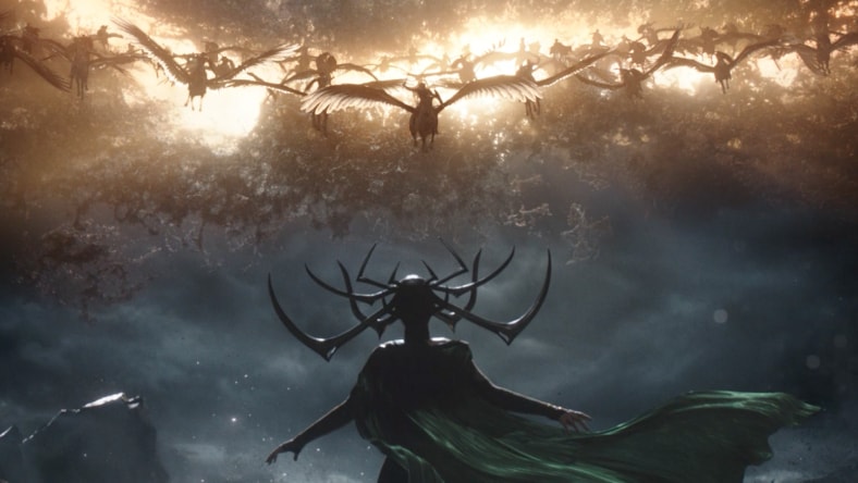 On-set view of special effects production involving a helicopter body suspended from a crane-sized controller arm