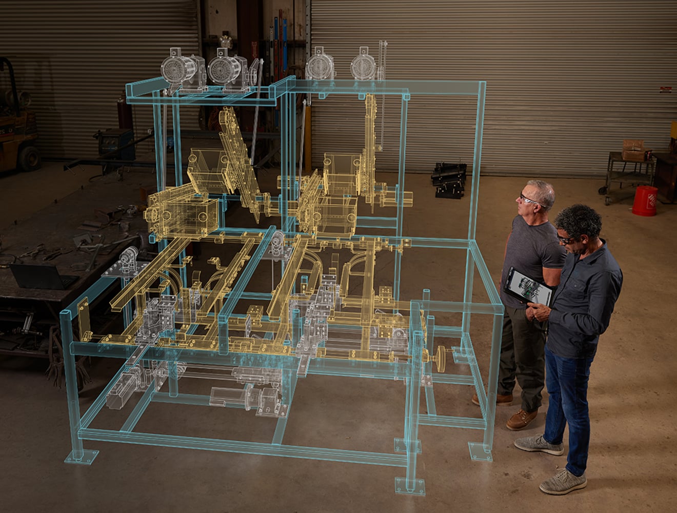 Engineers inspecting machine design on shop floor