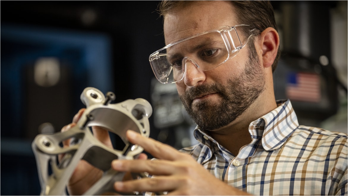 Man working in the metal shop at the Autodesk San Francisco Technology Center.