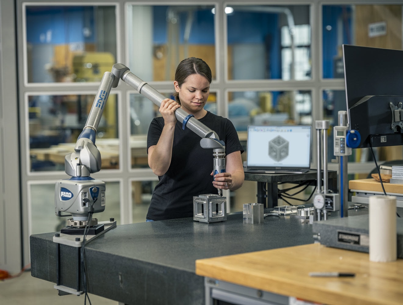 Woman using Fusion for CAM automation.