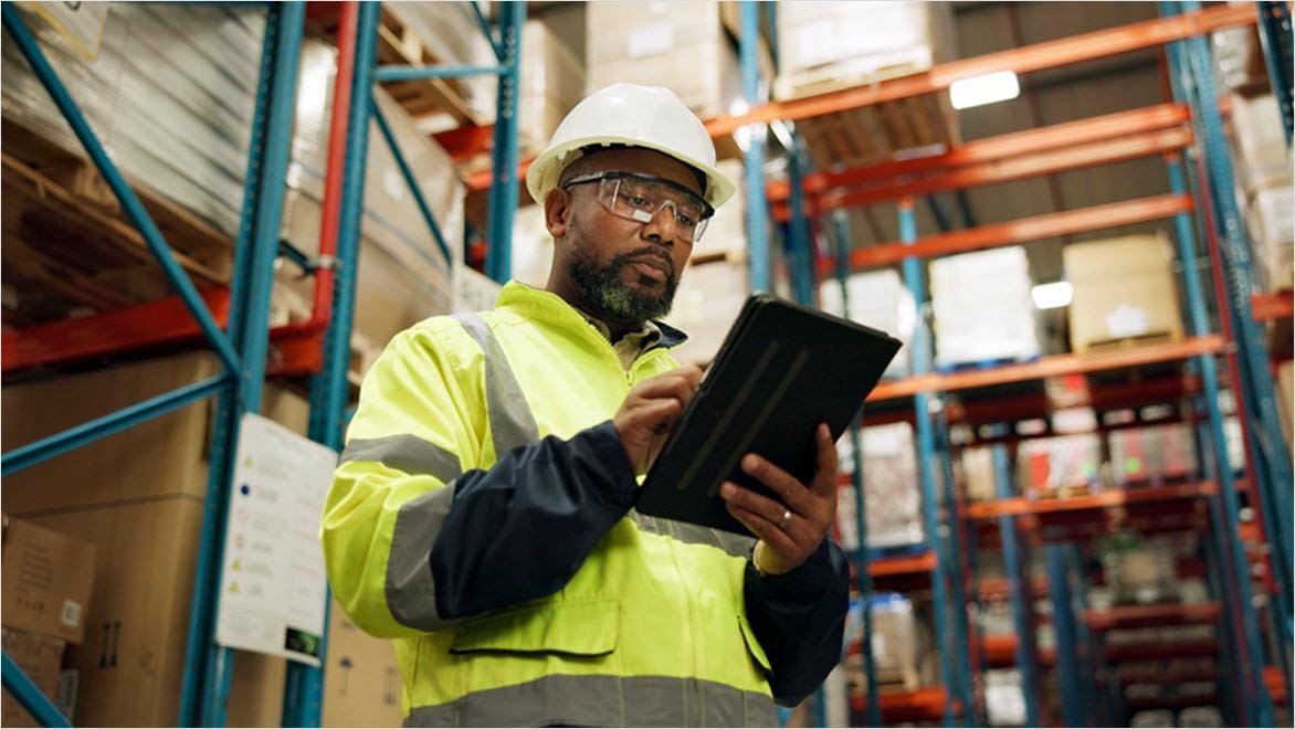Man using PLM for inventory management
