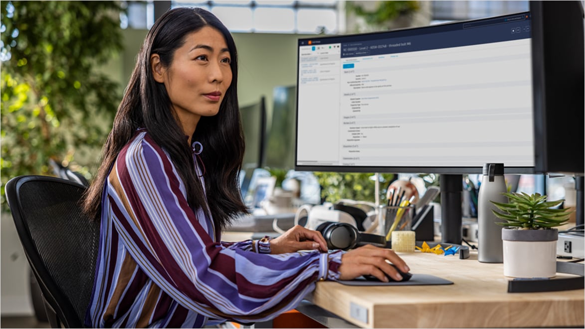Woman using Autodesk Fusion Manage