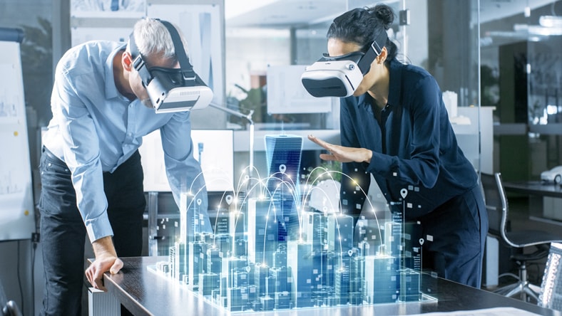 Workers reviewing a design using VR goggles