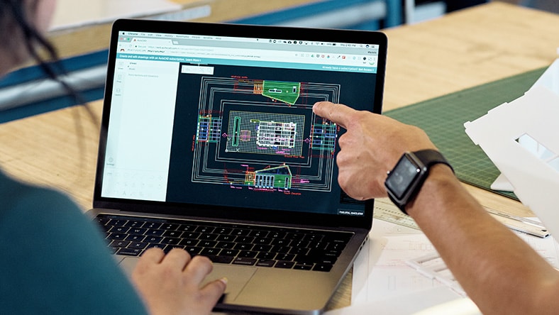Architects working with AutoCAD to laser cut architectural models