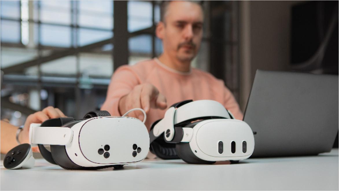 Two VR headsets sitting on a table