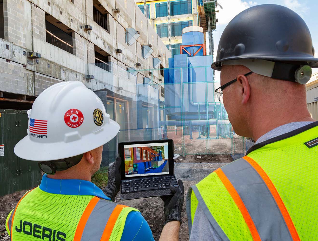 People using AutoCAD in construction site