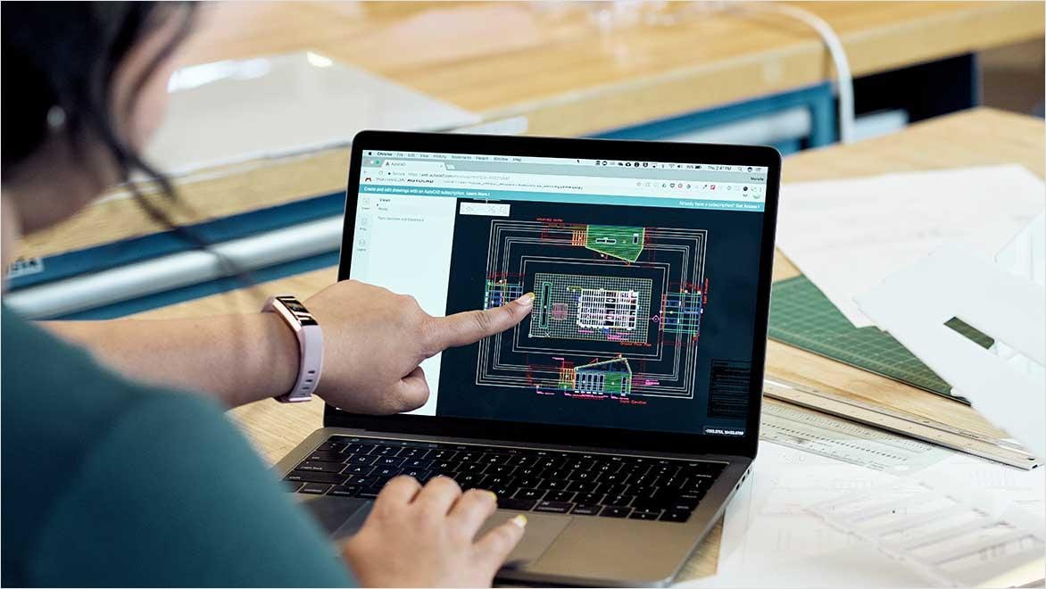 Architects working with AutoCAD to laser cut architectural models.