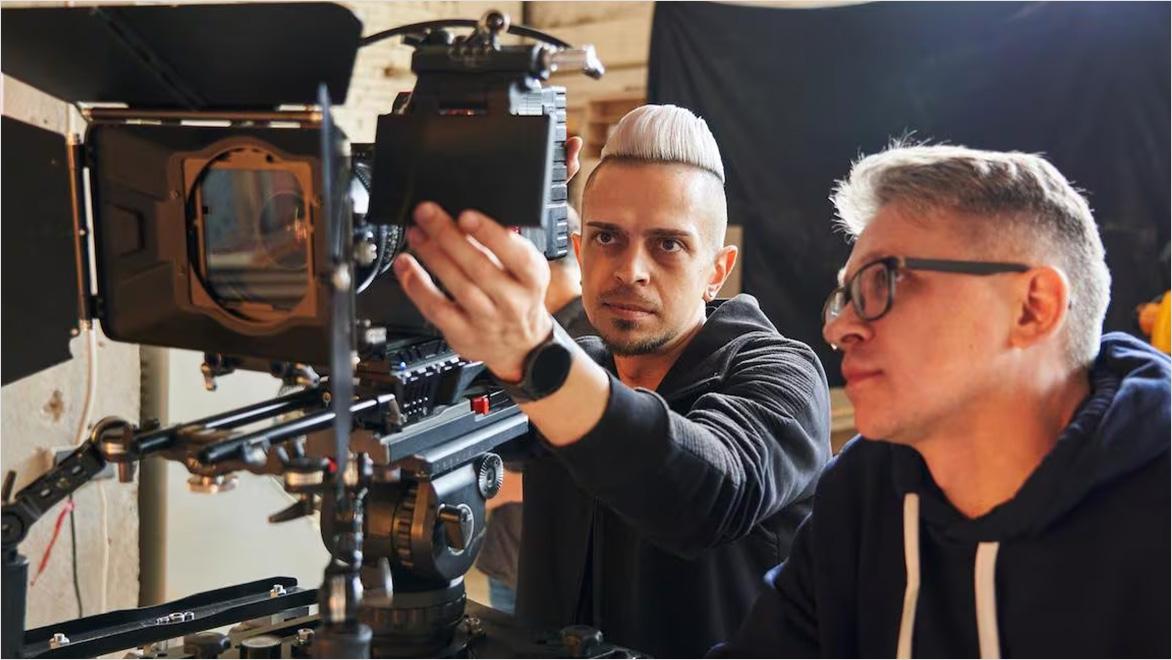 Filmmakers on-set reviewing footage