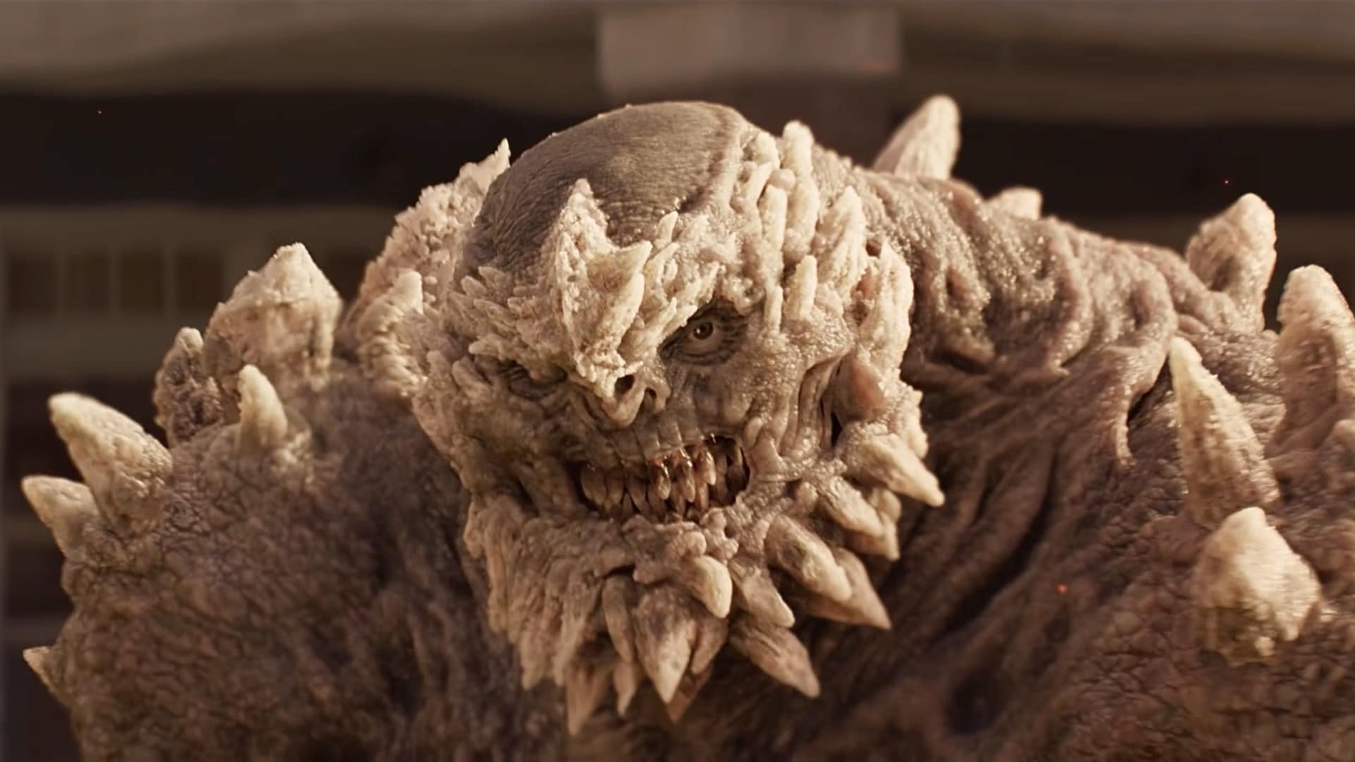 Gnarly 3D monster resembling a spiky ogre with angry eyes and menacing teeth