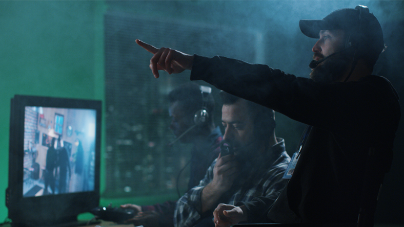 Director reviewing footage on set