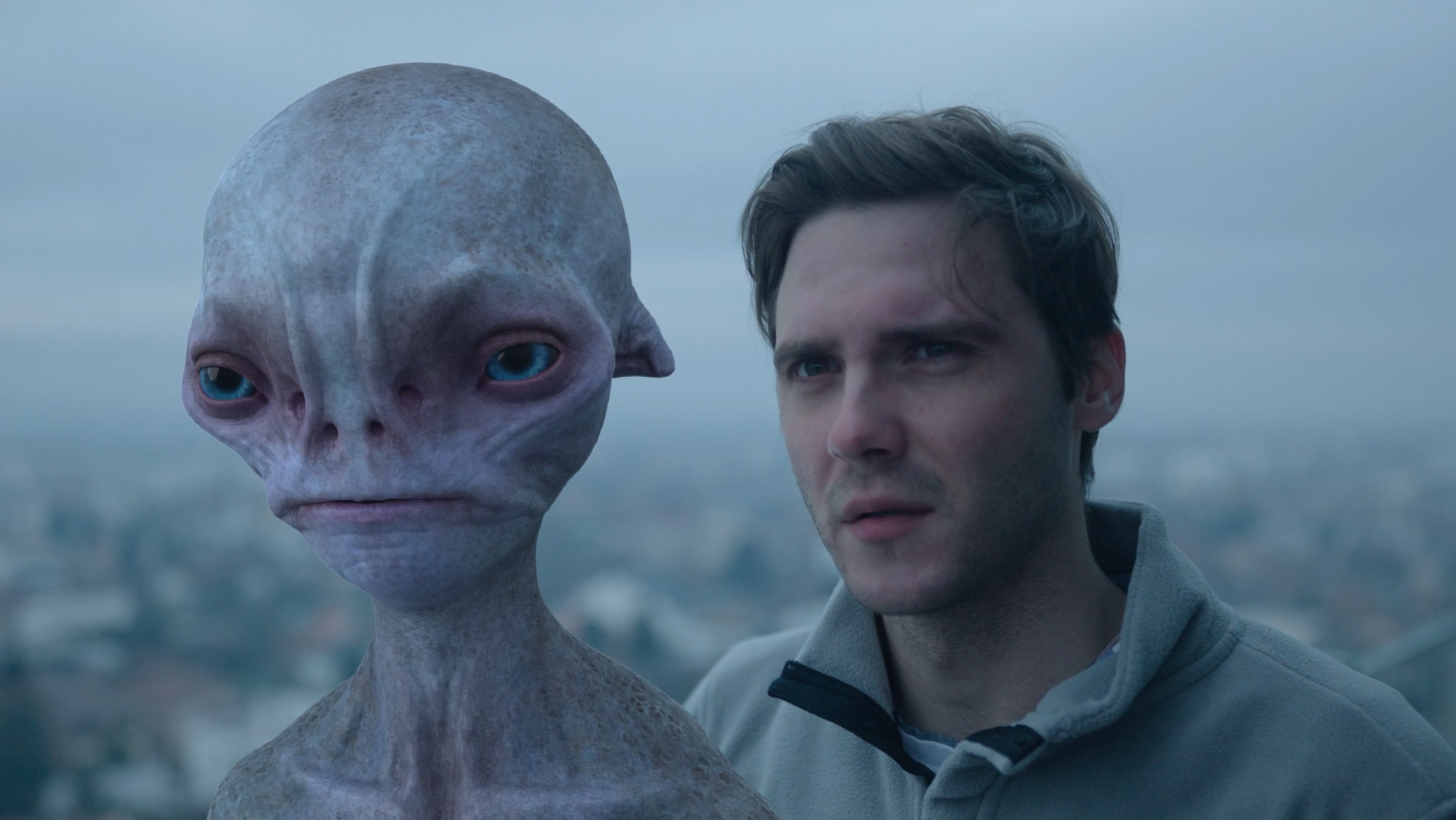 alien and man side-by-side