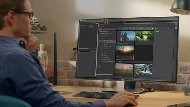 A man working in Avid at his desk.