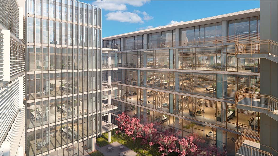 Commercial office building rendering with glass facade.