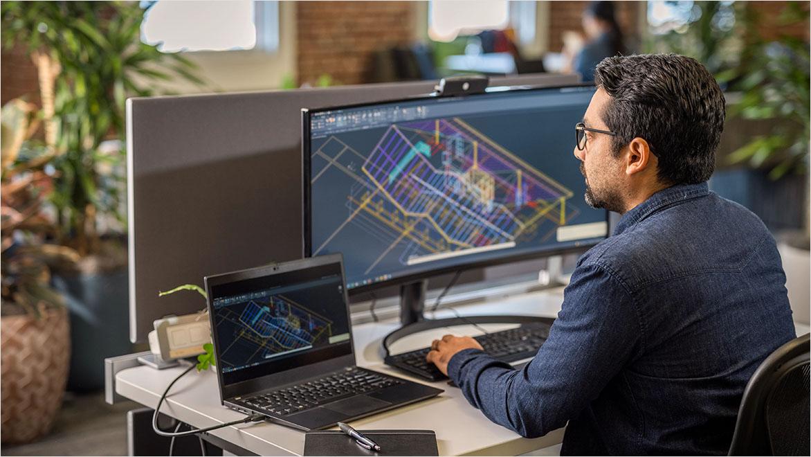 Man using AutoCAD in an office environment