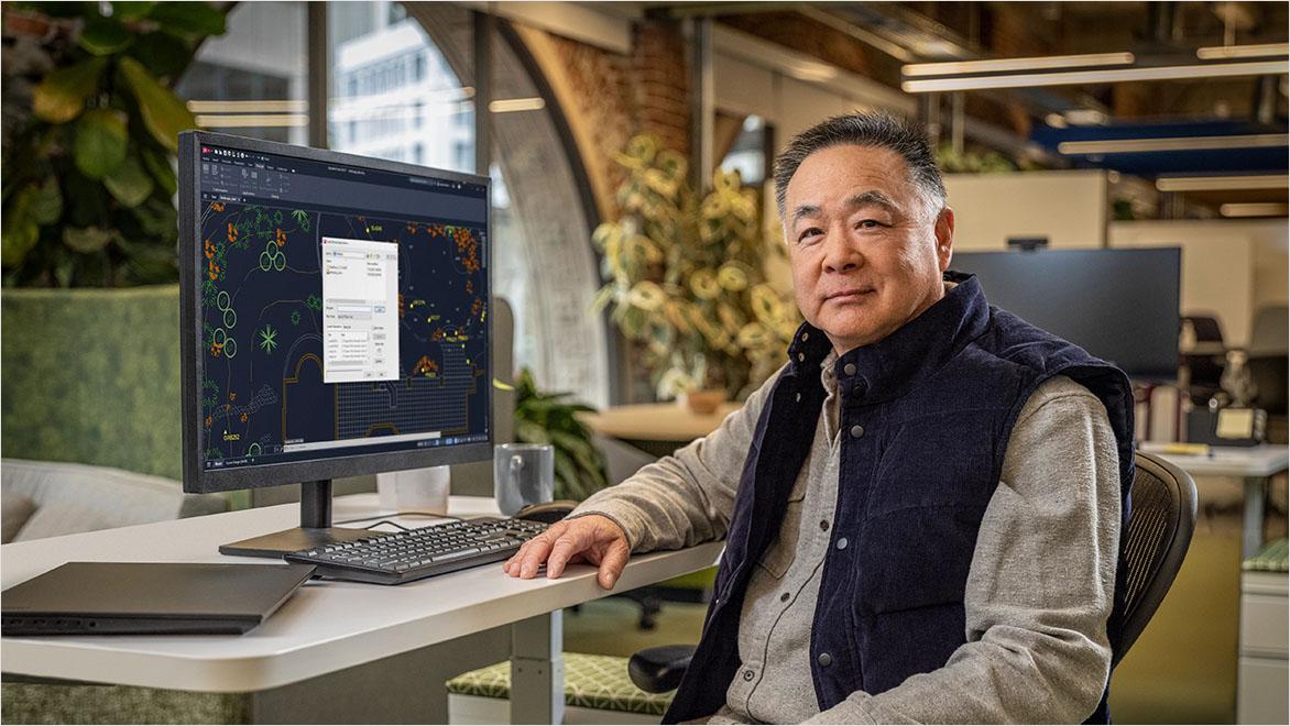 Man using AutoCAD in an office environment