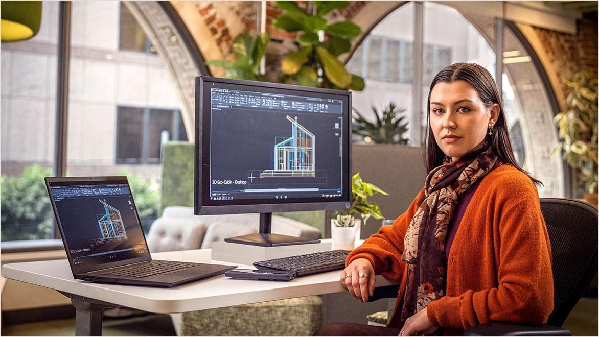 Woman using AutoCAD in an office environment