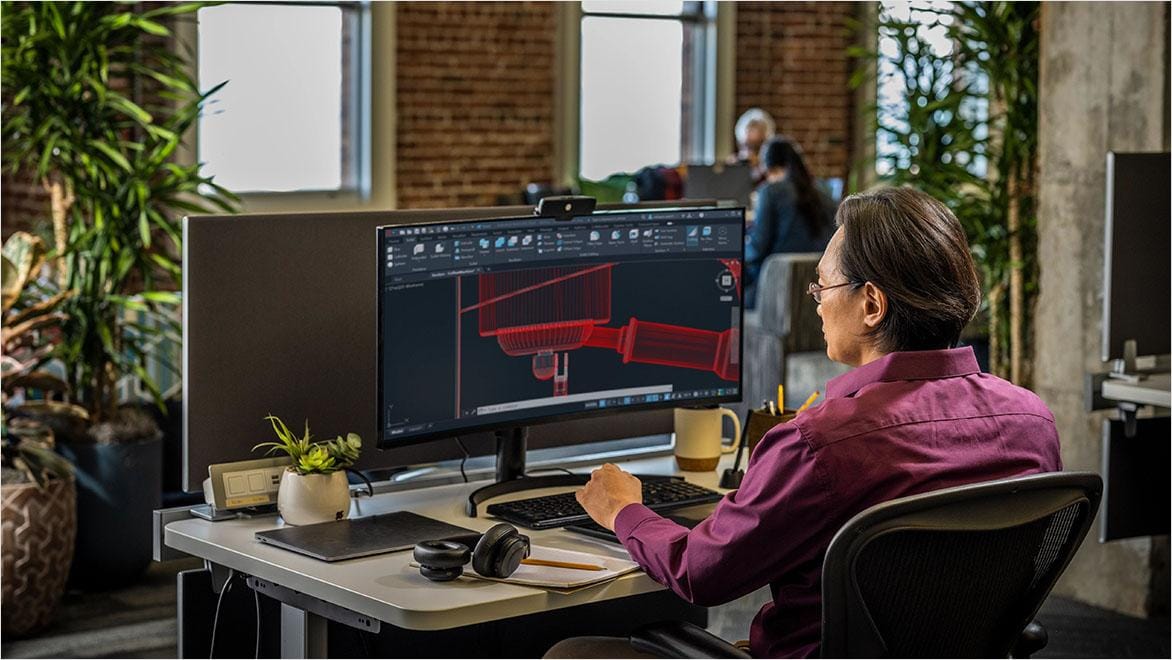 Professional reviewing 3D AutoCAD design.