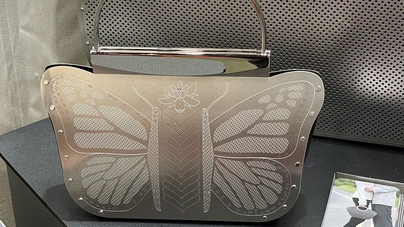 Butterfly-shaped metallic handbag