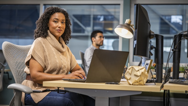 Employee in a workspace, representing product or experience-related role