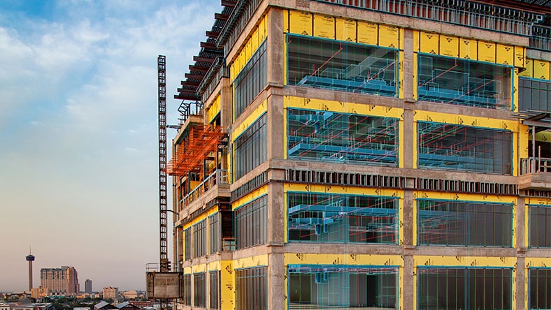 Modern construction building with AI-powered digital twin overlay.