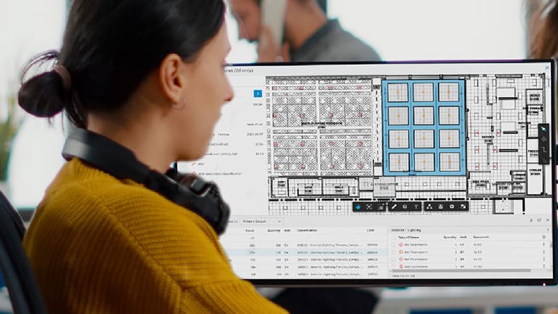 Construction team using AI technology on building site.