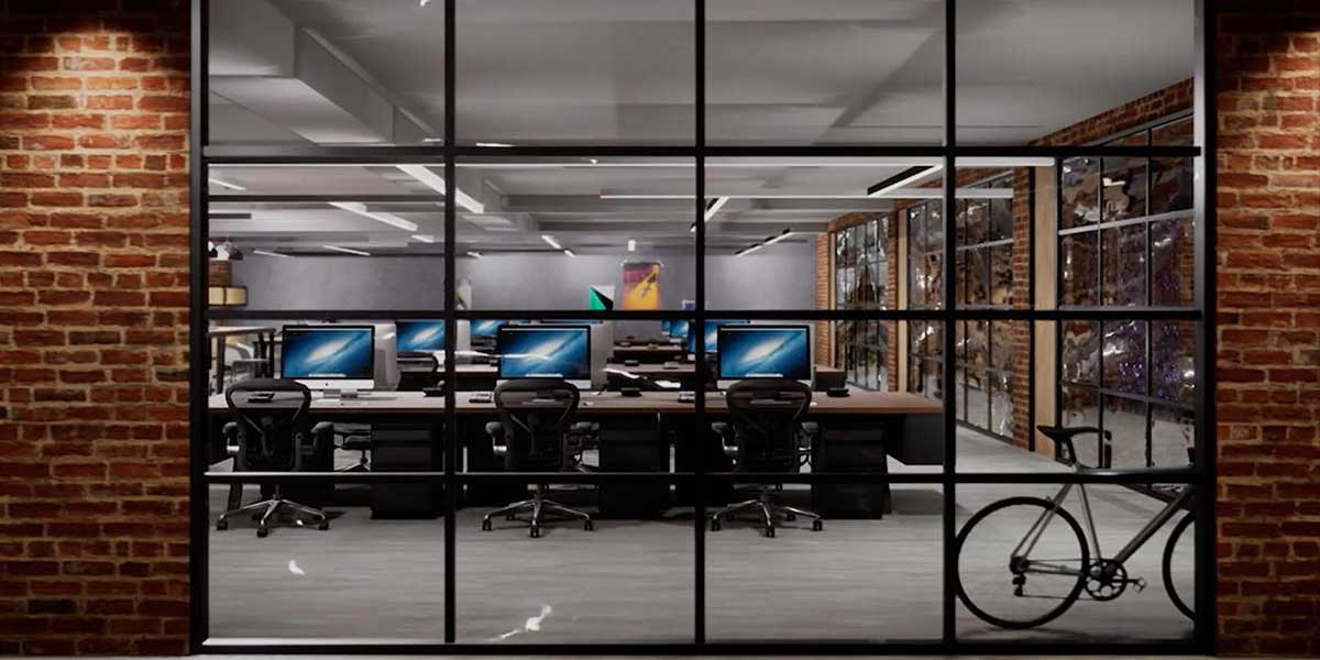 3ds Max と Unreal Engine で作られたレンガ倉庫風のオフィスにパソコンデスクが並んでいて自転車が置いてある