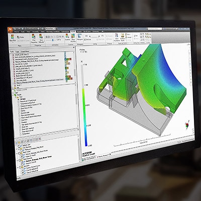 a man standing off to the side in front of a computer-generated diagram