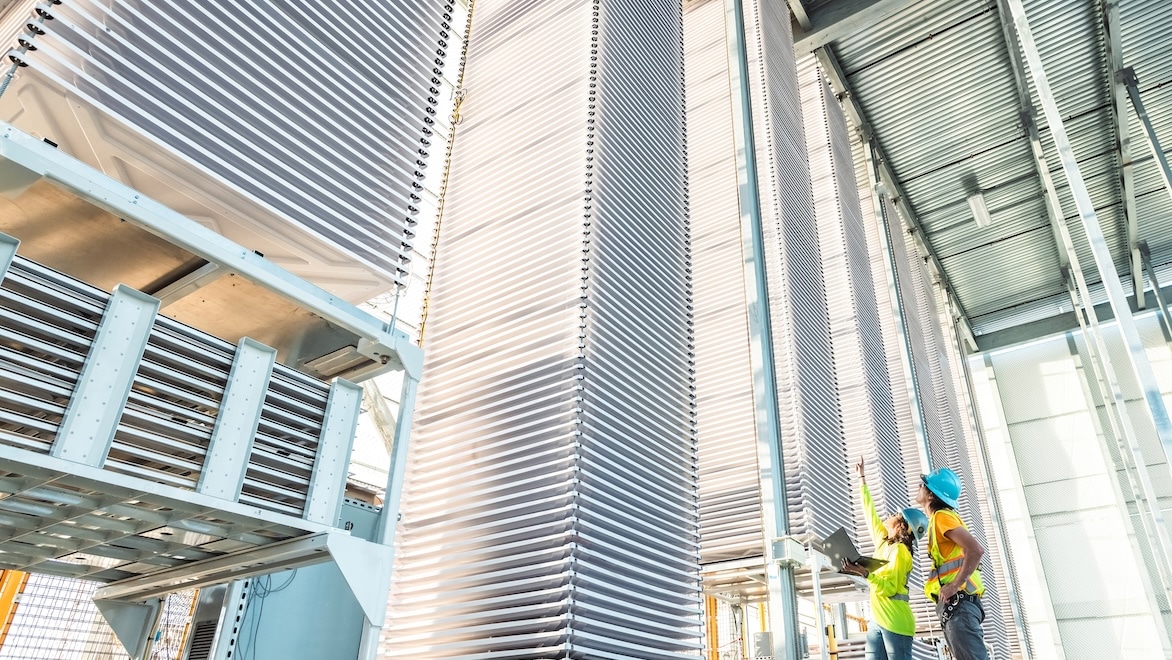 At Heirloom's direct air capture facility, stacks of large trays hold calcium oxide powder to absorb CO2 from the air over 3 days to become calcium carbonate, or limestone.