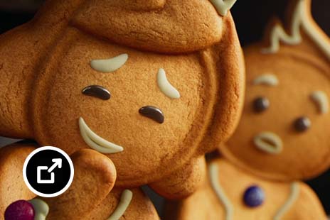 A gingerbread cookie giggling
