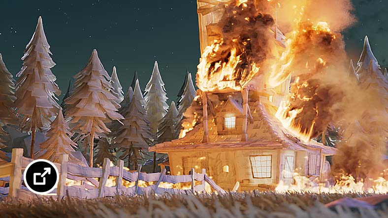 Tall house on fire at night