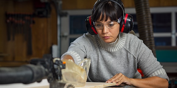 A woman working in the wood shop at the Autodesk San Francisco Technology Center.