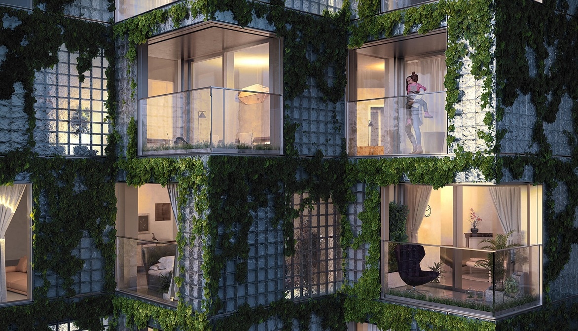 KING Toronto のガラス ブロック ファサードの夜間のレンダリング。45 度の角度で並ぶ住宅ユニットはつる性植物に覆われ、明かりがともっている