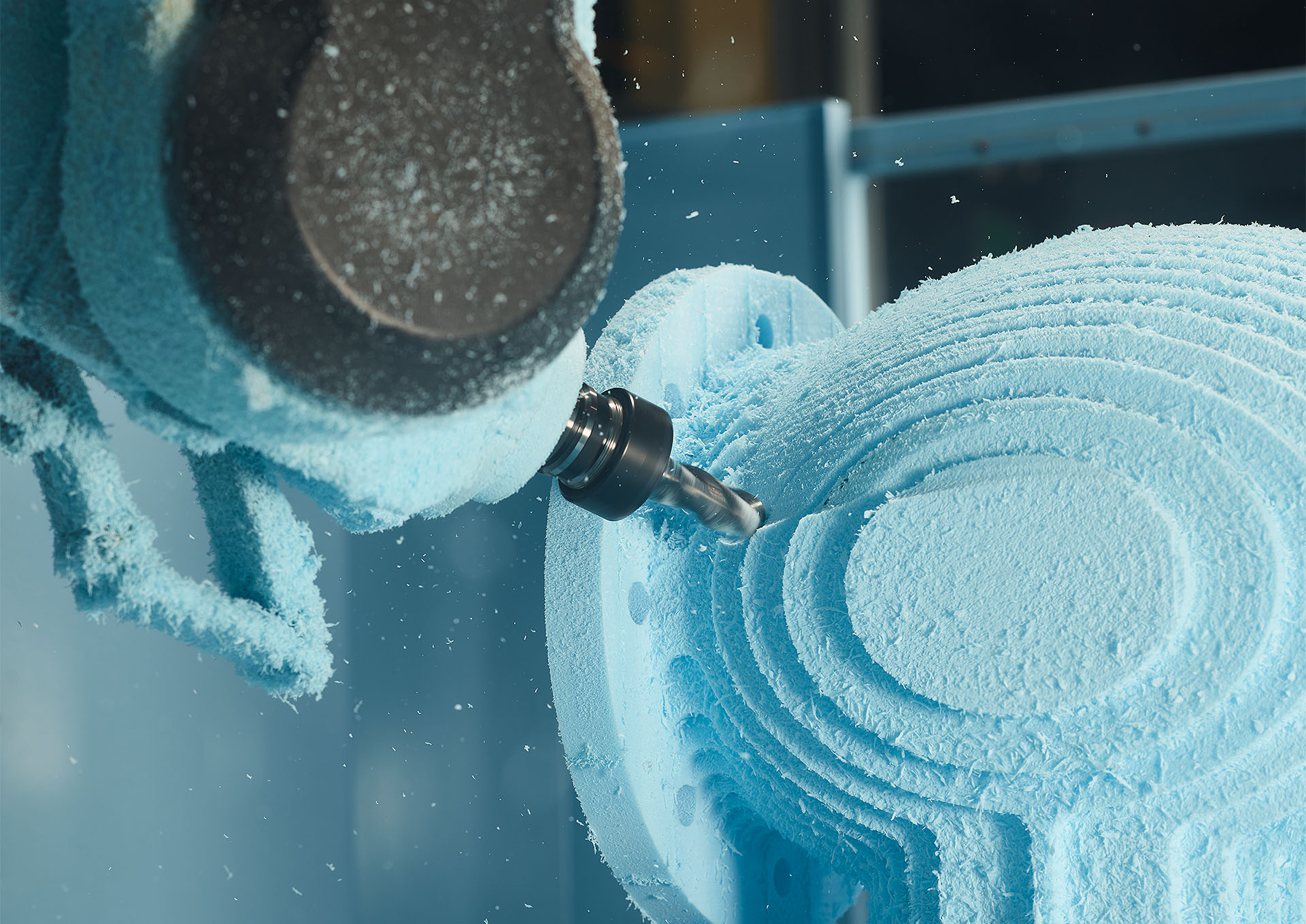 A drill shaping material into spirals.