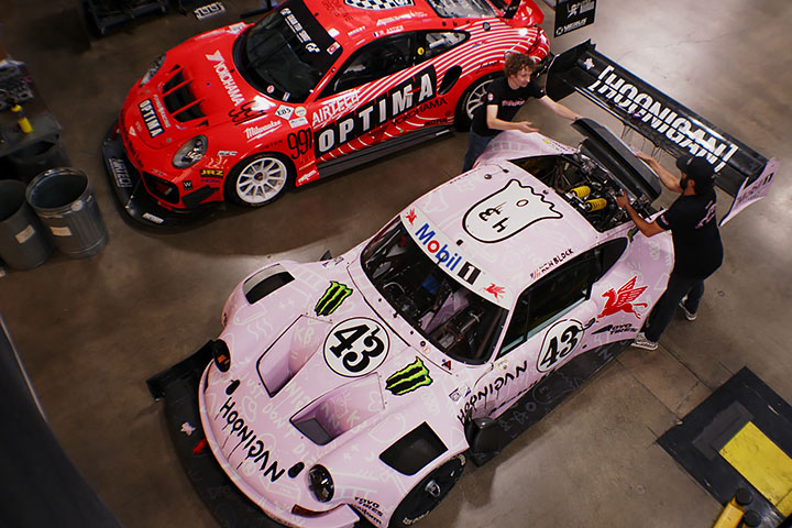 The BBi Autosport team works on a customized race car in their automotive shop.
