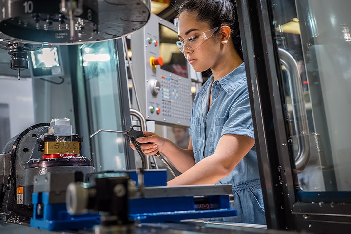 Woman working at the CNC lab at Diablo Valley College in Pleasant Hill, California. 