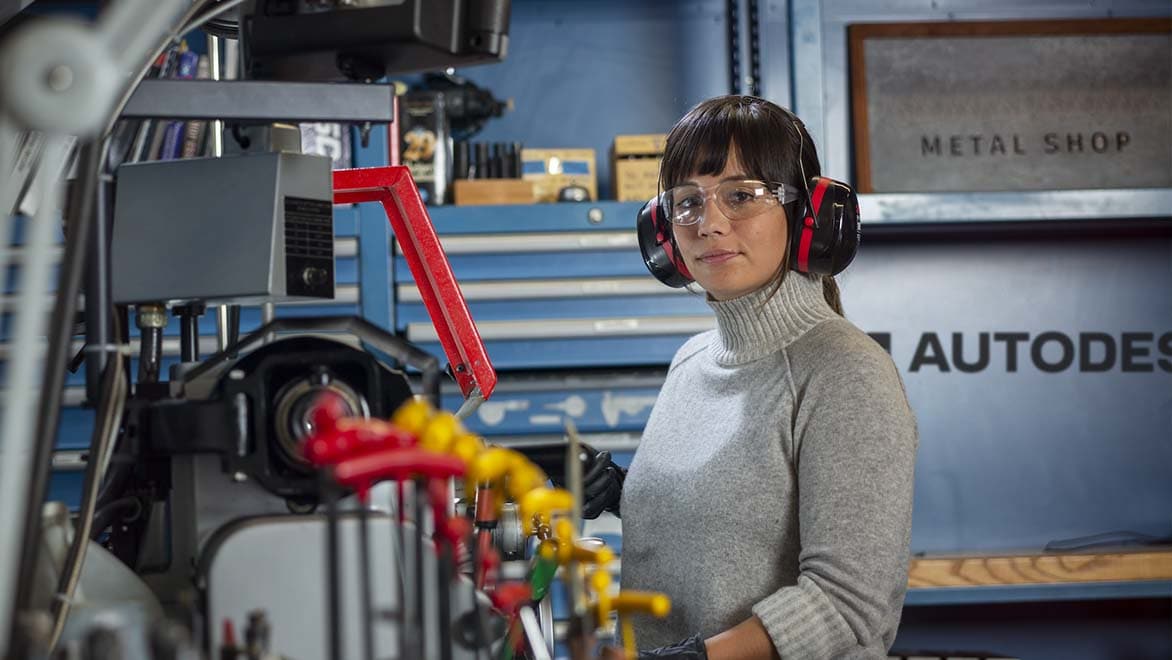 A woman works in the metal shop at the Autodesk San Francisco Technology Center. 