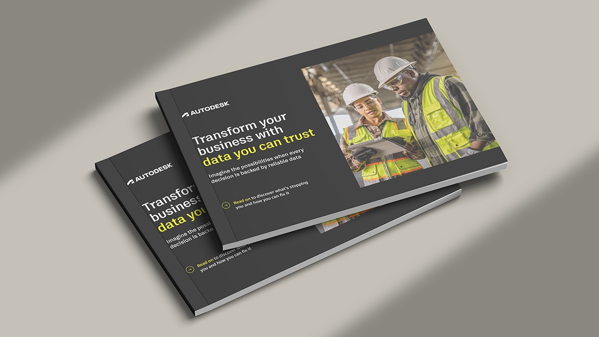 The cover image for the Autodesk e-book titled: Transform your business with data you can trust, featuring a male and a female construction worker working on a tablet on-site.