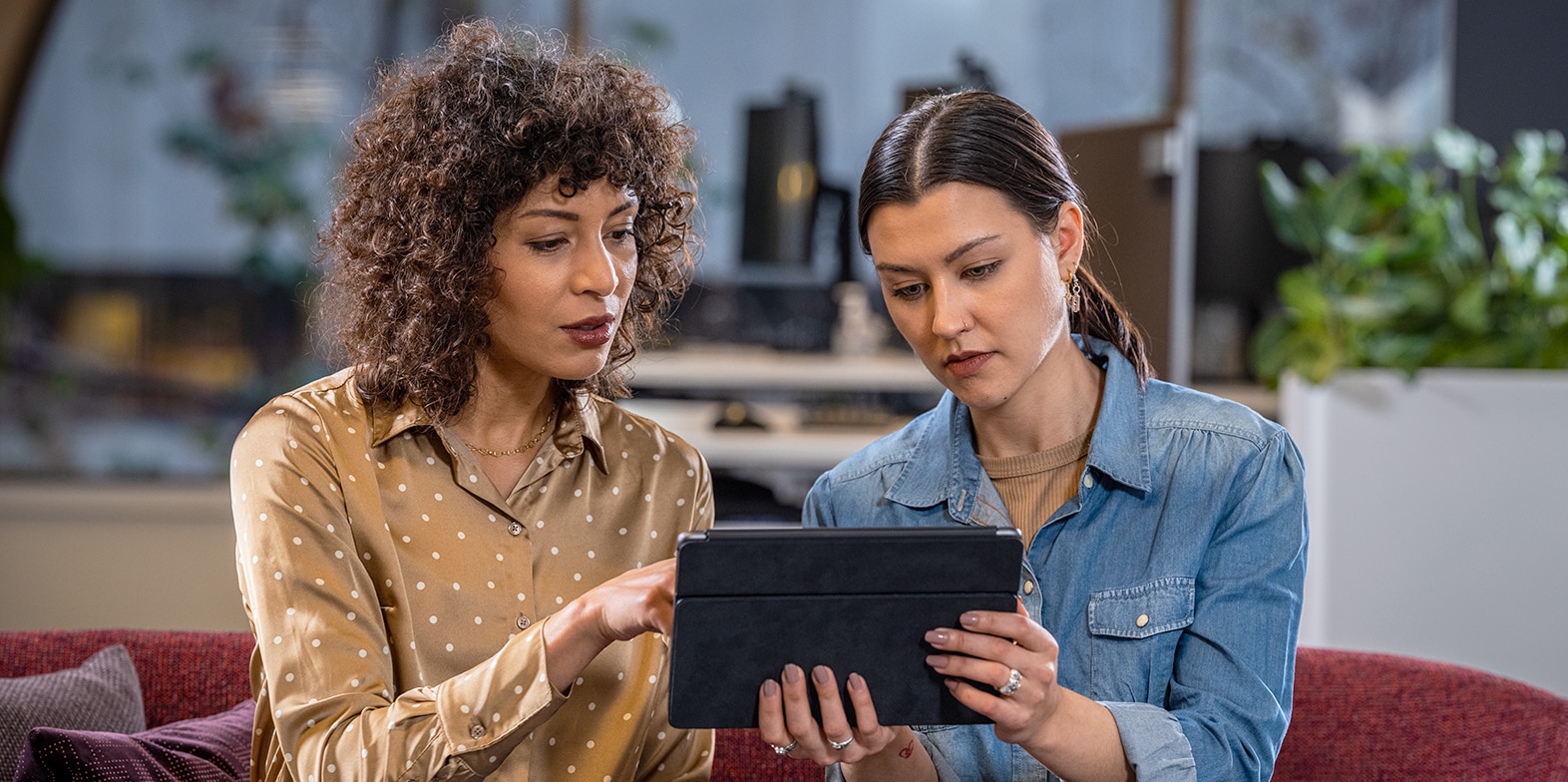 Two women looking at a tablet
