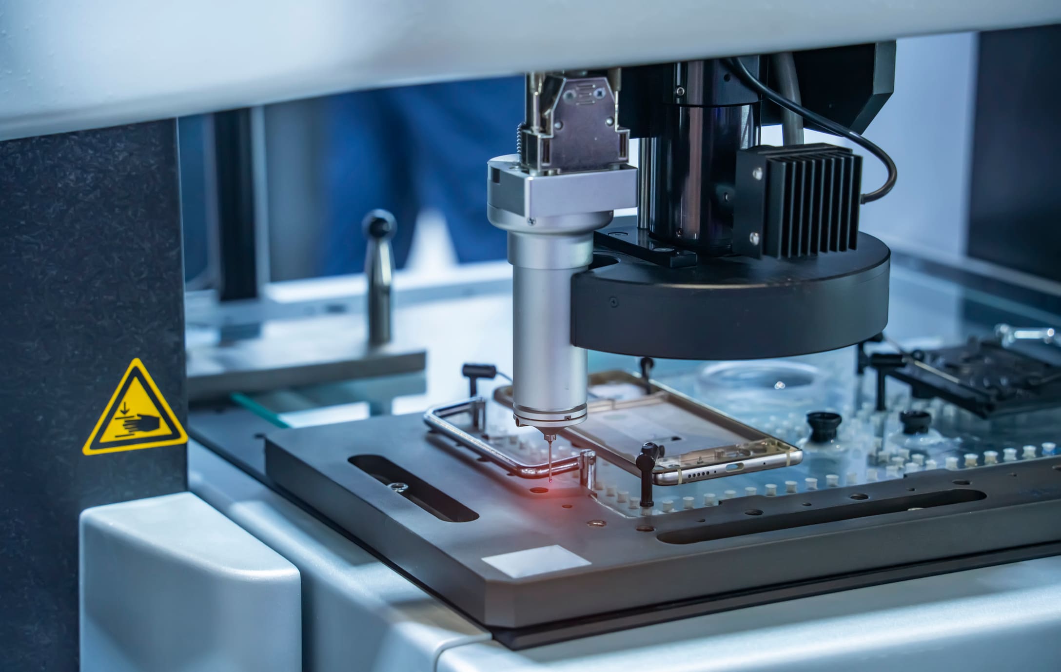 1394868476 A precision CNC machine with a milled cellphone case.