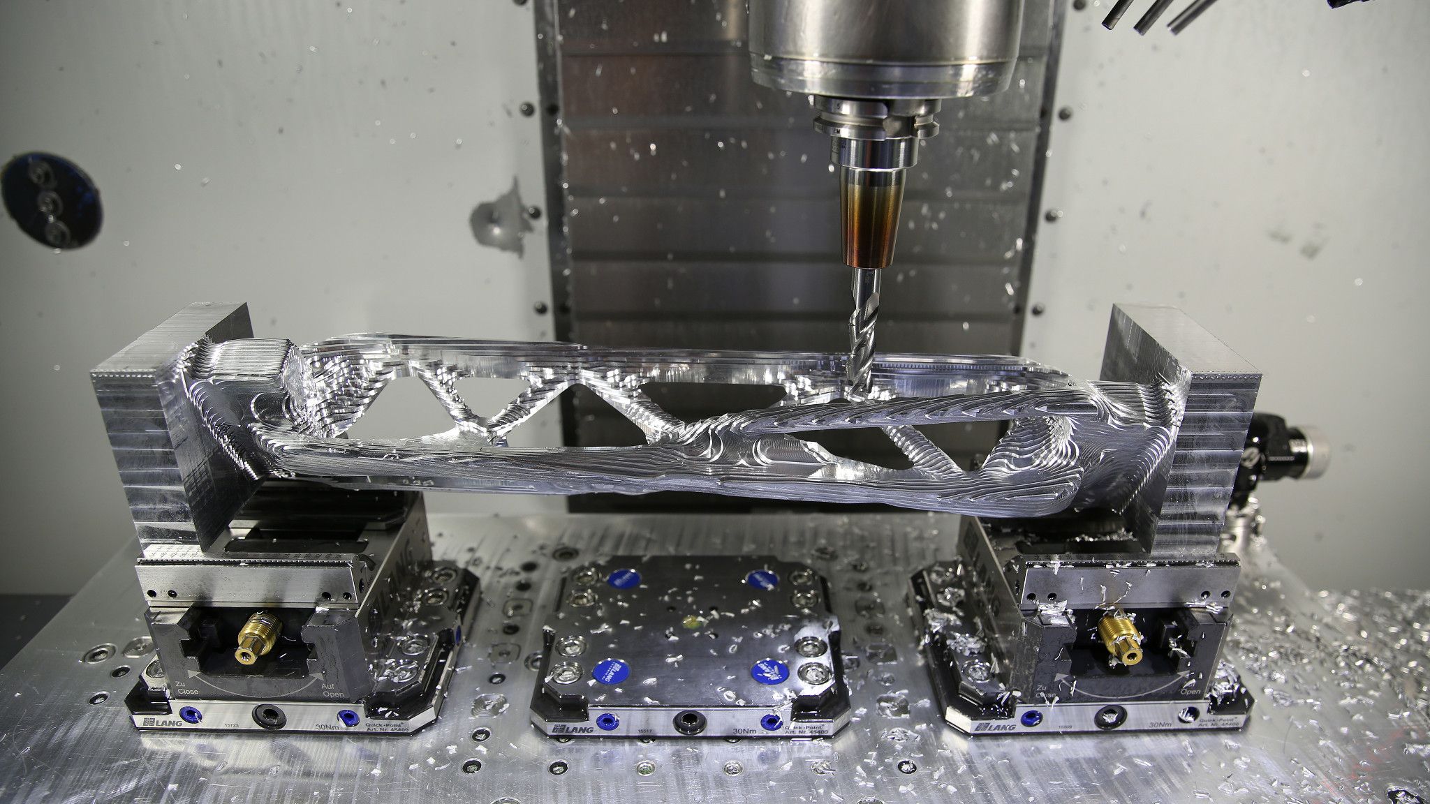 A CNC machine is milling a metal part for the JPL Lander, a collaborative research project between Autodesk and NASA’s Jet Propulsion Lab.