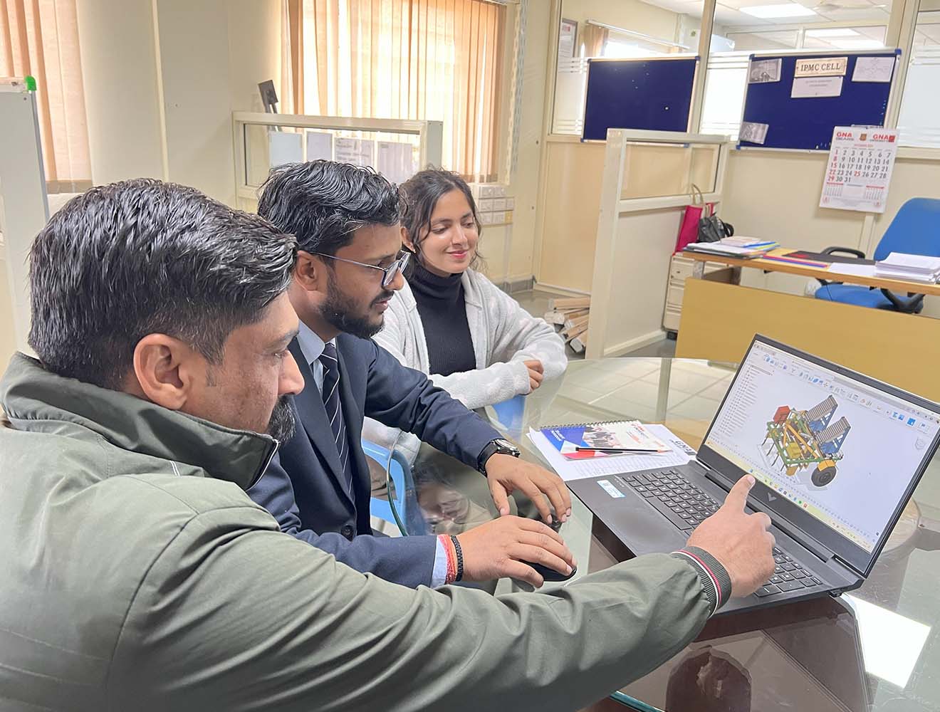 Features students and the "automated multi-vegetable transplanter" agriculture machine