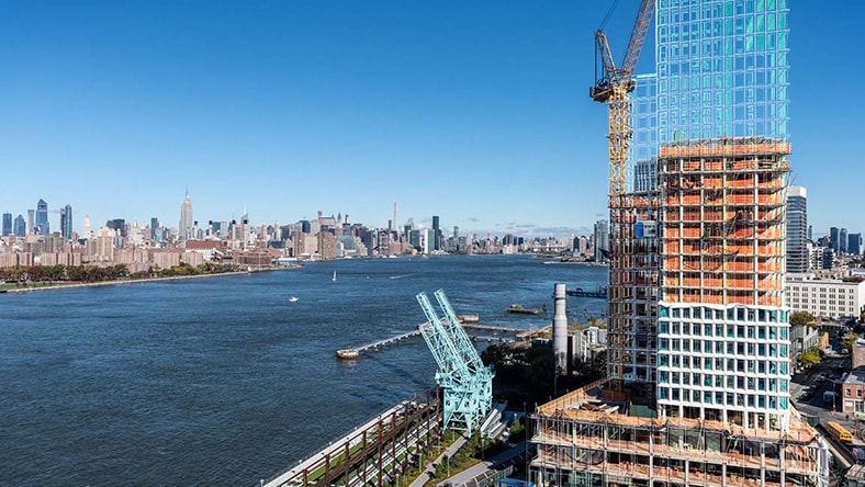 High-rise construction project with digital building visualization.