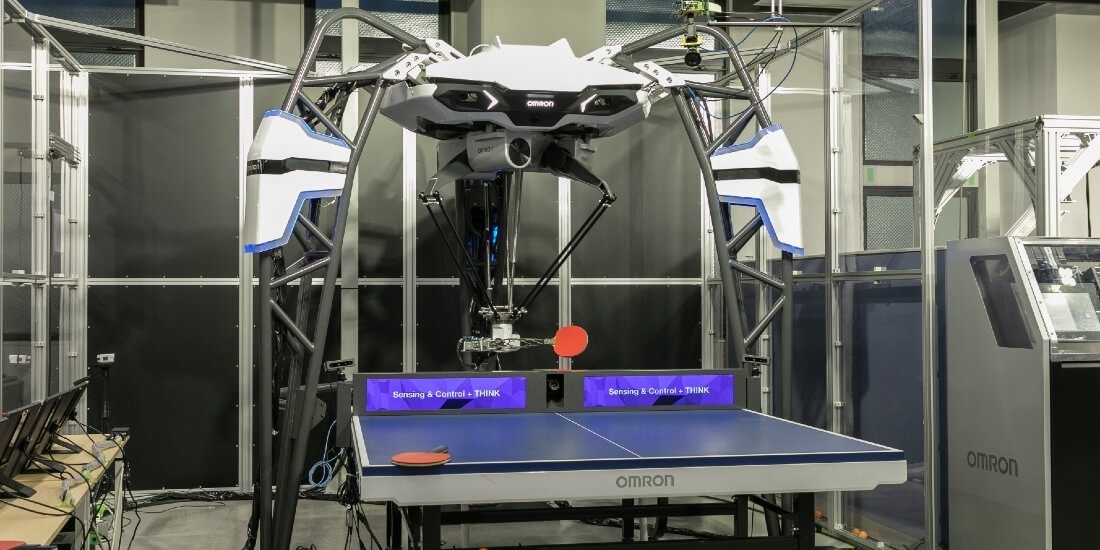 OMRON’s FORPHEUS table tennis–playing robot is set up at one end of a table tennis table.